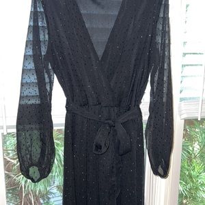 Flow length black formal dress with black sequin details. Size Medium.